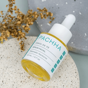 Serum facial reparador nocturno  con un flor